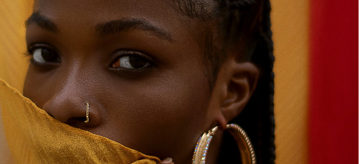 Photo by Adegboye Habeeb: https://www.pexels.com/photo/close-up-photo-of-a-woman-covering-her-mouth-with-a-yellow-fabric-9238599/